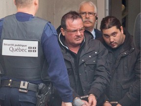 Raynald Desjardins, left, and Felice Racaniello exit the Joliette courthouse,  north of Montreal on Wednesday December 21, 2011.