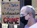 A small group of Palestinian and Jewish groups protest in support of Palestinians and call on Canada to sanction Israel for the last week of conflict in the Middle East outside the Israeli consulate in Montreal on Monday, May 17, 2021.