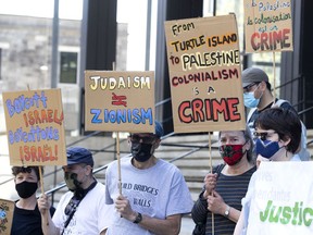 Palestinian and Jewish groups protest outside the Israeli consulate in Montreal on Monday, May 17, 2021.