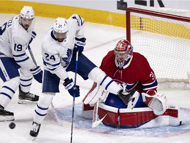 Toronto Maple Leafs right wing Wayne Simmonds (24) crowds Montreal Canadiens goaltender Carey Price (31) as Leafs center Jason Spezza (19) looks on during NHL playoff action in Montreal on Monday, May 24, 2021. (Allen McInnis / MONTREAL GAZETTE) ORG XMIT: 66189