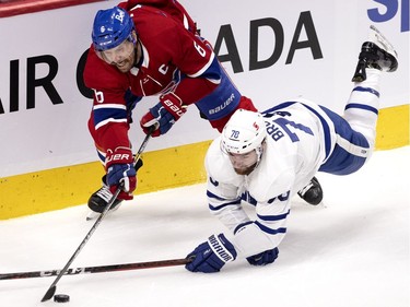 Montreal Canadiens defenseman Shea Weber (6) manages to move the puck forward after colliding with Toronto Maple Leafs defenseman T.J. Brodie (78) during NHL playoff action in Montreal on Monday, May 24, 2021. (Allen McInnis / MONTREAL GAZETTE) ORG XMIT: 66189