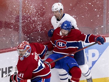 Montreal Canadiens defenseman Jeff Petry (26) checks Toronto Maple Leafs center Jason Spezza (19) as goaltender Carey Price (31) dashes back to his net during NHL playoff action in Montreal on Monday, May 24, 2021. (Allen McInnis / MONTREAL GAZETTE) ORG XMIT: 66189