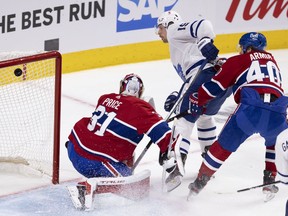Toronto Maple Leafs center Jason Spezza (19) watches his shot get past Montreal Canadiens goaltender Carey Price (31) as Joel Armia (40) looks on during NHL playoff action in Montreal on Tuesday, May 25, 2021.
