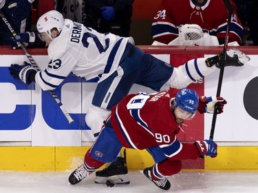 Montreal Canadiens left wing Tomas Tatar (90) checks Toronto Maple Leafs defenseman Travis Dermott (23) during NHL playoff action in Montreal on Tuesday, May 25, 2021.