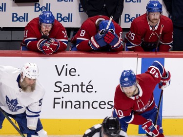Montreal Canadiens right wing Brendan Gallagher (11), left to right, defensemen Ben Chiarot (8) and  Jeff Petry (26) show their disappointment in the final moments of the game as the Canadiens lost 4-0 during NHL playoff action in Montreal on Tuesday, May 25, 2021.