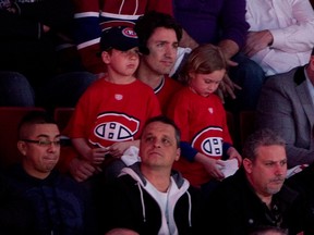 Justin Trudeau and his sons cheering on the Montreal Canadiens in the playoffs in 2014.