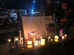 People hold a candlelight vigil in memory of Joyce Echaquan on September 29, 2020. The Atikamekw mother of seven died at the Joliette hospital after having been insulted, including with a barrage of racist stereotypes, by some staff members.