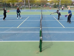 Brigitte Philippon, left, Danielle Cohen, Serge Boileau and Johanne Belair play pickleball at Heritage Park in Kirkland on Friday May 7, 2021.