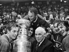 May 18, 1971: Game 7 of the Stanley Cup final between the Canadiens and the Blackhawks ended in glory: Canadiens captain Jean Béliveau, left, Henri Richard, top centre, with NHL commissioner Clarence Campbell in Chicago.