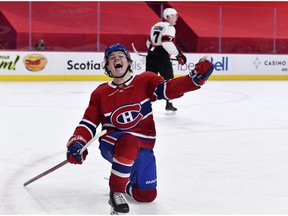 The Canadiens’ Cole Caufield celebrates after scoring his first NHL goal in overtime for a 3-2 win over the Ottawa Senators Saturday night at the Bell Centre.