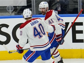 Canadiens forward Paul Byron, who had just scored what proved to be the winning goal vs. the Maple Leafs, is congratulated by teammate Joel Armia Thursday night.