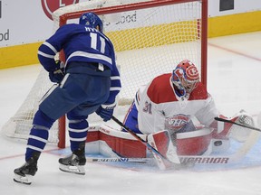 Canadiens goalie Carey Price makes a save on Maple Leafs forward Zach Hyman Thursday night in Toronto. Price made 32 saves in all, some of them outstanding.