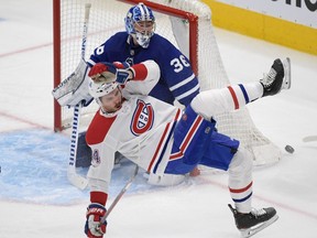 Canadiens forward Joel Edmundson loses his balance in front of Maple Leafs goalie Jack Campbell in the first period at Scotiabank Arena in Toronto on Saturday, May 8, 2021.