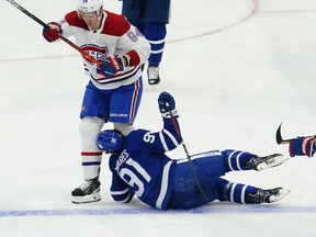 Maple Leafs centre John Tavares is hit in the head by Canadiens' Corey Perry during the first period of Game 1 of the teams' playoff series Thursday night. Tavares was conscious and communicating after the game, but remained overnight in a Toronto hospital for further evaluation.