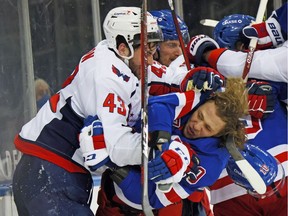 Tom Wilson, left, of the Washington Capitals battles Artemi Panarin of the New York Rangers at Madison Square Garden in New York on May 3, 2021.