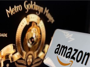 FILE PHOTO: Smartphone with Amazon logo is seen in front of displayed MGM logo in this illustration taken, May 26, 2021. REUTERS/Dado Ruvic/Illustration/File Photo