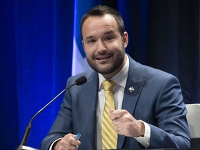 Quebec Family Minister Mathieu Lacombe  reacts to a reports on youth, Tuesday, May 4, 2021  in Quebec City.