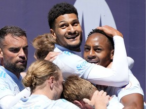 CF Montréal forward Mason Toye (right) reacts after scoring a goal against the Chicago Fire during the second half at Soldier Field in Chicago on Saturday, May 29, 2021.