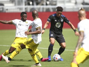 CF Montréal forward Erik Hurtado controls the ball around Columbus Crew SC defender Aboubacar Keita during the first half in Fort Lauderdale, Fla., May 1, 2021.