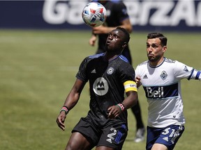 CF Montréal midfielder Victor Wanyama (2) looks to settle the ball past Vancouver Whitecaps midfielder Russell Teibert (31) in the first half at Rio Tinto Stadium on Saturday, May 8, 2021, in Sandy, Utah.
