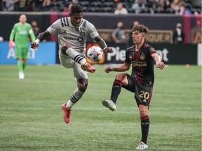 CF Montréal forward Romell Quioto kicks the ball past Atlanta United midfielder Emerson Hyndman during the second half at Mercedes-Benz Stadium in Atlanta last week.