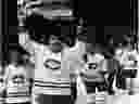 Montreal Canadiens' captain Serge Savard leads the parade of his teamates carrying the Stanley Cup around the ice after the Canadiens won the championship for the fourth consecutive times in Montreal, May 21, 1979 against the Rangers. (CP PHOTO/Arne Glassbourg) ORG XMIT: 906011