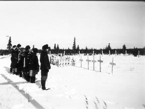 Residential school students at Fort George cemetery, near James Bay, in November 1946. Quebec high school students learn far too little about residential schools and Indigenous perspectives are not voiced, Julia Kaplan says.