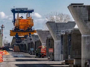 Construction of the REM at Highway 40 in Dollard-des-Ormeaux continues on Thursday March 25, 2021.