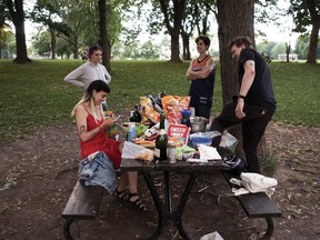 Clockwise from the bottom left: Ines Anaya, Clea Stuart, Amanda McQueen and Mark Meeste in Jeanne-Mance Park shortly before curfew in Montreal Wednesday, May 26, 2021. Montrealers have rediscovered our passion for parks, especially those without back yards or balconies.