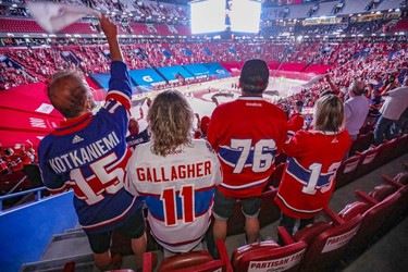 Montreal Canadiens fans cheer for their team at the start of  playoff game against the Winnipeg Jets in Montreal on Monday, June 7, 2021.