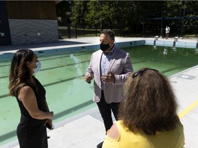 Pierrefonds-Roxboro Mayor Jim Beis speaks with people during a visit on Wednesday to the soon to open new Versailles Pool.