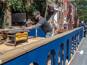 Terraces are able to open tomorrow and Bar Mineral co-owner Mathieu Menard works on the bar's terrace on Atateken Street in Montreal on Thursday June 10, 2021.