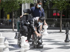 Abdullah Farooq places his knight after taking rook during game of chess at Place des Festivals. He was on an outing with Natasha Patry from the Mackay Centre.