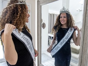 Miss Teenage Quebec Aaliya Arthur tries on her crown and sash at her home in the Île-Bizard suburb of Montreal on June 4, 2021.