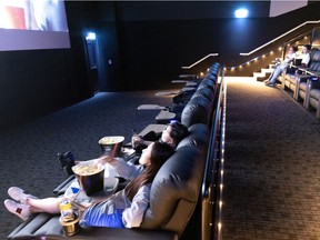 Invited guests take part in a dry run as the Forum Cineplex unveils new VIP theatres in Montreal on Tuesday, June 15, 2021.