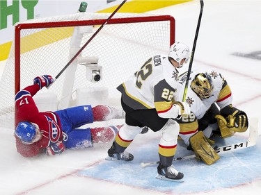 Canadiens' Josh Anderson is checked into the goal post by Vegas Golden Knights' Chandler Stephensen next to goalie Marc-André Fleury during the first period of the National Hockey League playoff game in Montreal on Friday, June 18, 2021.