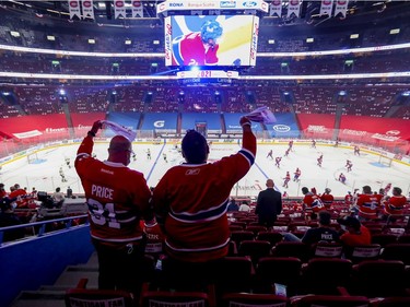 Canadiens fans wave towels during the warmup prior to the National Hockey League playoff game against the  Vegas Golden Knights in Montreal on Friday, June 18, 2021.