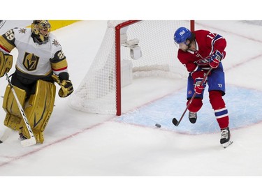 Canadiens' Josh Anderson shoots the puck into the empty Vegas Golden Knights net after goalie Marc-André Fleury mishandled it during the third period of a National Hockey League playoff game in Montreal on Friday, June 18, 2021.