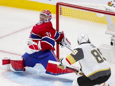 Canadiens' Carey Price slides across the crease to stop a shot by Vegas Golden Knights' Alex Tuch during the third period of a National Hockey League playoff game in Montreal on Friday, June 18, 2021.