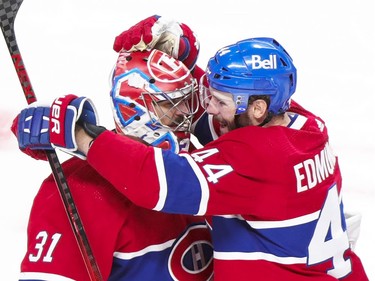 Montreal Canadiens Joel Edmundson hugs Carey Price following overtime victory over the Vegas Golden Knights in National Hockey League playoff game in Montreal Friday June 18, 2021.