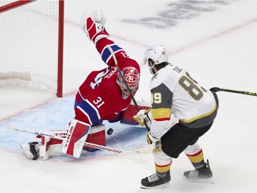 Canadiens' Carey Price makes a save against Golden Knights' Alex Tuch during the second period Friday night at the Bell Centre.