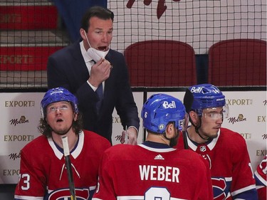 Canadiens assistant coach Luke Richardson speaks to defenceman Shea Weber during a break in play during the first period of a National Hockey League playoff game against the Vegas Golden Knights in Montreal on Friday, June 18, 2021.  Richardson was acting as head coach following interim head coach Dominic Ducharme's positive COVID-19 test.