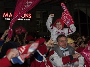 Montreal Canadiens fans cheer outside Bell Centre for Game 3 of the third round of the NHL playoff series between the Montreal Canadiens vs. Vegas Golden Knights in Montreal Friday, June 18, 2021.