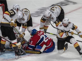Montreal Canadiens right wing Josh Anderson (17) and Vegas Golden Knights defenseman Nick Holden (22) collide along the boards in the Montreal end during 1st period NHL Stanley Cup Semifinal action at the Bell Centre in Montreal on Sunday June 20, 2021. Dave Sidaway / Montreal Gazette