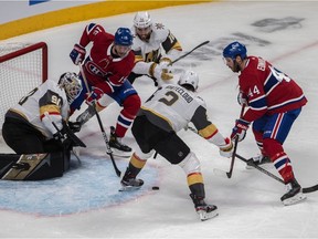 Montreal Canadiens centre Jesperi Kotkaniemi (15) and defenseman Joel Edmundson (44) can't get to the loose puck in front of Vegas Golden Knights goaltender Robin Lehner during first period in Game 4 at the Bell Centre in Montreal on June 20, 2021.