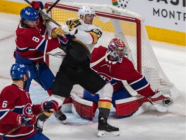 Canadiens goaltender Carey Price makes a save with Canadiens defenceman Ben Chiarot (8) checking Vegas Golden Knights' lMax Pacioretty (67) in front of the net during the first period of NHL Stanley Cup semifinal action at the Bell Centre in Montreal on Sunday, June 20, 2021.