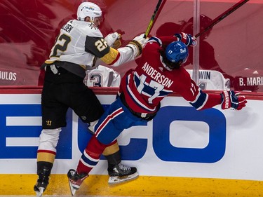 Montreal Canadiens right wing Josh Anderson (17) and Vegas Golden Knights defenseman Nick Holden (22) collide along the boards in the Montreal end during 1st period NHL Stanley Cup Semifinal action at the Bell Centre in Montreal on Sunday June 20, 2021. Dave Sidaway / Montreal Gazette ORG XMIT: 66309