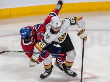 Canadiens'Phillip Danault (24) collides with Vegas Golden Knights' Alex Tuch (89) during second period NHL Stanley Cup semifinal action at the Bell Centre in Montreal on Sunday, June 20, 2021.