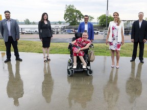 Montreal mayoral candidate Denis Coderre, centre rear, with his Ensemble Montréal slate of candidates in Lachine. For borough councillor: Simon Masella, left; Lise Poulin, front; Denis Boucher, right. Julie Pascale-Provost, second from right, is candidate for borough mayor, while Josée Côté, is candidate for city councillor.