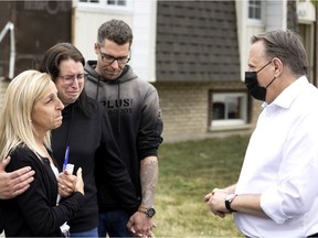 Quebec premier François Legault visits the widow of Jacques Lefebvre, who died in during a tornado, in Mascouche north of Montreal on Tuesday, June 22, 2021.